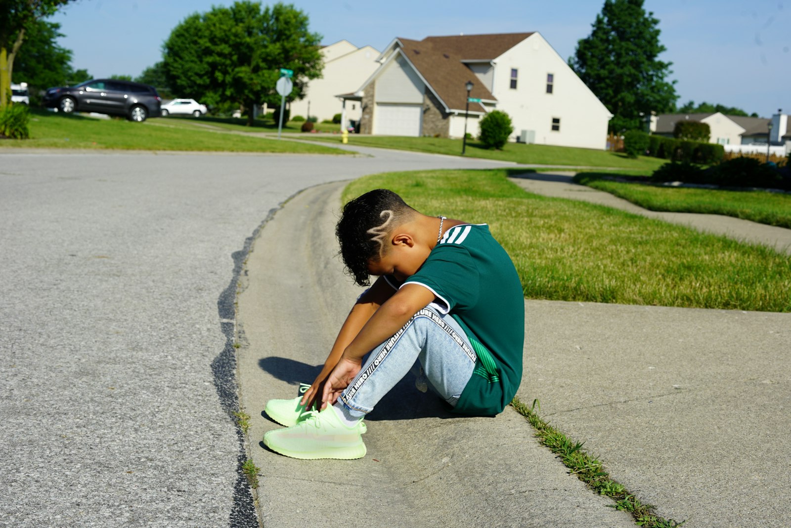 boy sits on pavement and head down What to Do After the Meltdown
