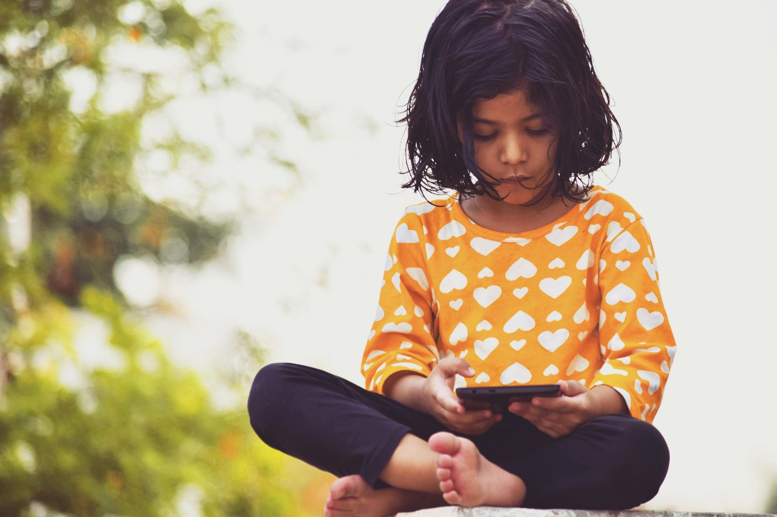 girl’s orange and white top The algorithm