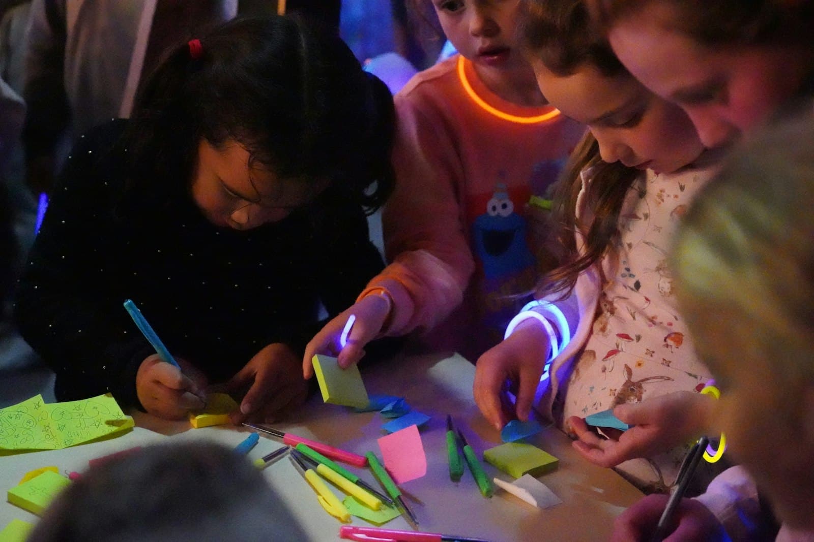 a group of children are playing with sticky notes Creativity skills for kids